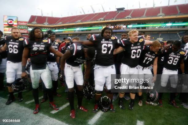 The South Carolina Gamecocks celebrate their 26-19 win over the Michigan Wolverines at the Outback Bowl NCAA college football game on January 1, 2018...