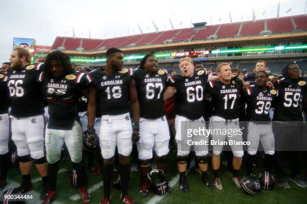The South Carolina Gamecocks celebrate their 26-19 win over the Michigan Wolverines at the Outback Bowl NCAA college football game on January 1, 2018...