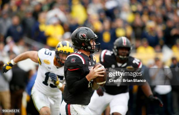 Quarterback Jake Bentley of the South Carolina Gamecocks looks for a receiver during the third quarter of the Outback Bowl NCAA college football game...