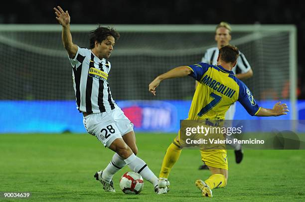 Ribas Da Cunha Diego of Juventus clashes with Michele Marcolini of Chievo during the Serie A match between Juventus FC vs AC Chievo Verona at...
