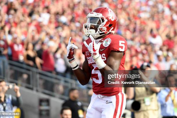 Wide receiver Marquise Brown of the Oklahoma Sooners celebrates after a 13-yard touchdown catch against the Georgia Bulldogs in the first quarter in...