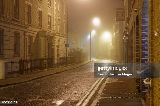illuminated alleys of wapping on the thames path, london, england, united kingdom - thames path stock pictures, royalty-free photos & images
