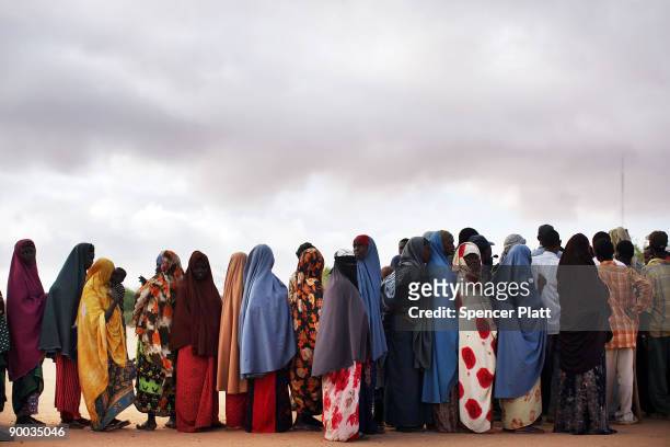 Somali refugees seek information about a move to a different displacement camp due to overcrowding August 24, 2008 at Dadaab, the world's biggest...