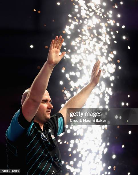 Rob Cross of England celebrates winning the PDC World Darts Championship final against Phil Taylor of England on Day Fifteen at the 2018 William Hill...