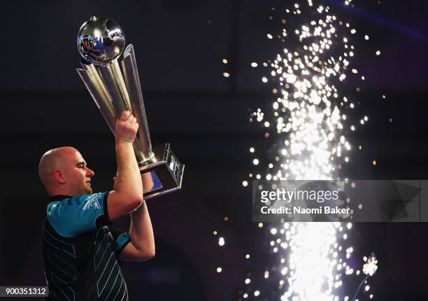 Rob Cross of England celebrates winning the PDC World Darts Championship final against Phil Taylor of England on Day Fifteen at the 2018 William Hill...