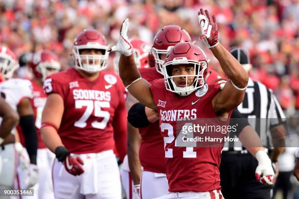 Running back Rodney Anderson of the Oklahoma Sooners celebrates after scoring on a nine-yard touchdown run in the first quarter against the Georgia...