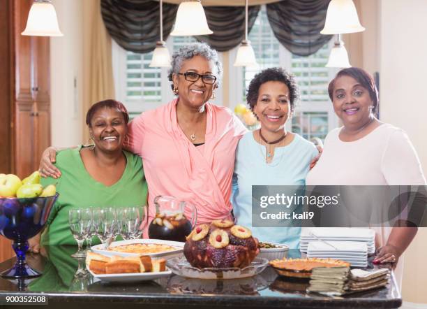 african-american women with home cooked meal - american pie reunion stock pictures, royalty-free photos & images