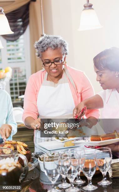 african-american women serving home cooked meal - southern food stock pictures, royalty-free photos & images