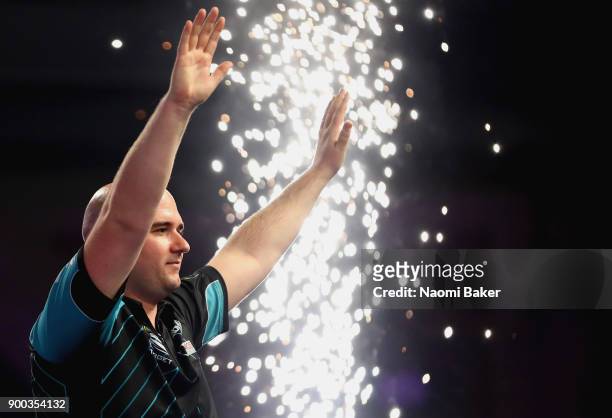 Rob Cross of England celebrates winning the PDC World Darts Championship final against Phil Taylor of England on Day Fifteen at the 2018 William Hill...