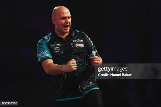 Rob Cross of England celebrates winning a set during the final match against Phil Taylor of England on Day Fifteen at the 2018 William Hill PDC World...