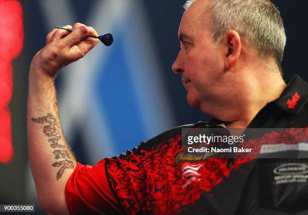 Phil Taylor of England in action during the PDC World Darts Championship final against Rob Cross of England on Day Fifteen at the 2018 William Hill...