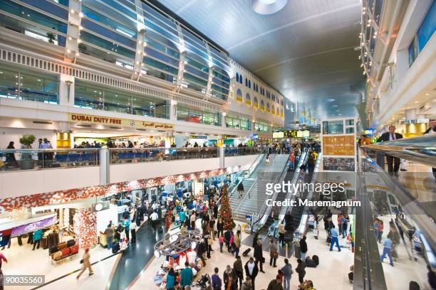 dubai international airport, the interior - crowded airport stock pictures, royalty-free photos & images