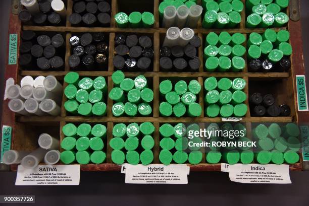 Pre-rolled marijuana cigarettes in sativa, indica and hybrid varieties are seen for sale at the Green Pearl Organics dispensary on the first day of...