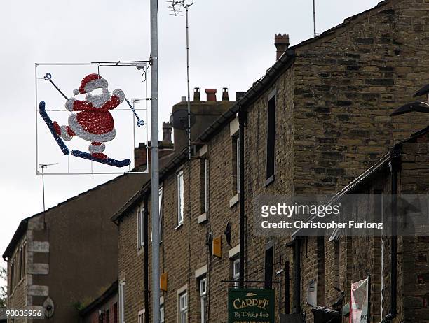 Santa on skis adorns a lamp post in Milnrow after workmen installed this year's Christmas lights four months early on August 24, 2009 in Rochdale,...