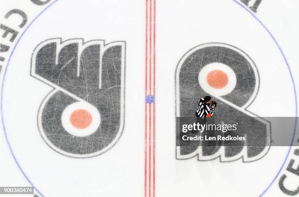 Referee Kelly Sutherland prepares for the start of his game between the Philadelphia Flyers and the Detroit Red Wings on December 20, 2017 at the...