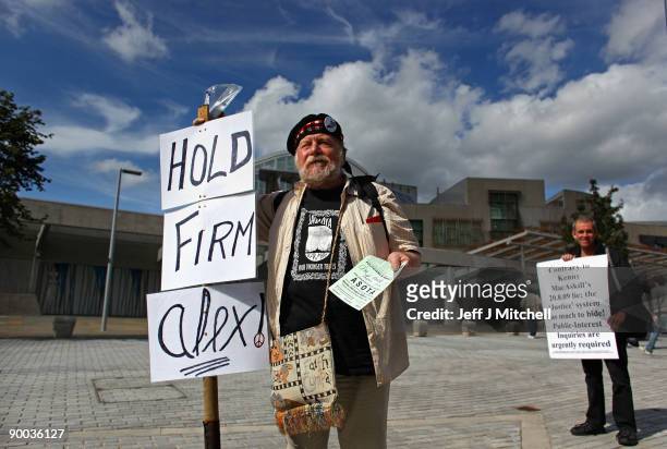 Protestors demonstrate outside of the Scottish Parliament ahead of Scottish Justice Secretary Kenny MacAskill's statement regarding the early release...