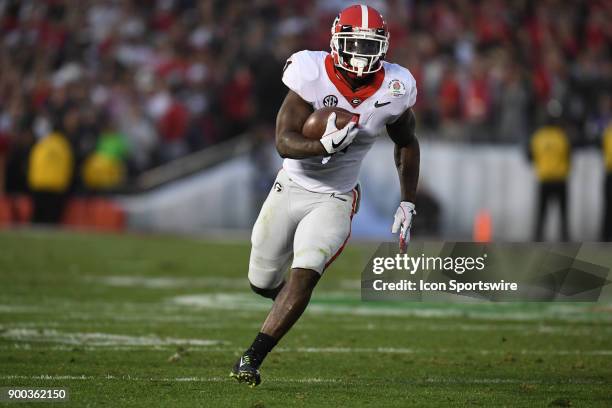 Sony Michel of the Georgia Bulldogs scores on a 38 Yd Run to tie the game 31-31 during the 3rd quarter of the College Football Playoff Semifinal at...