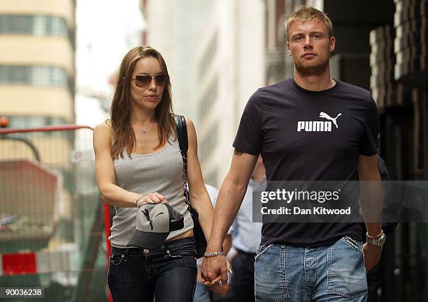 Andrew Flintoff walks with his wife Rachel as the England cricket team depart from their team hotel on August 24, 2009 in London, England. The...