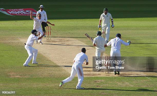 Graeme Swann of England celebrates the wicket of Michael Hussey of Australia and victory with team mates during day four of the npower 5th Ashes Test...