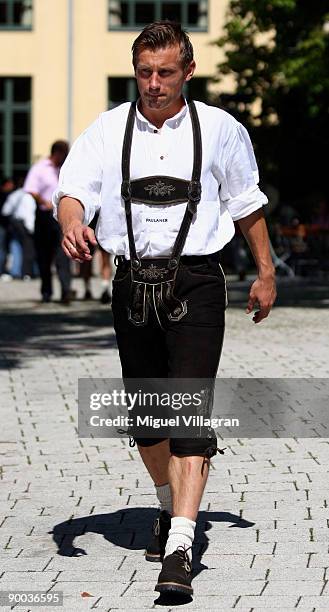 Ivica Olic wears a traditional Bavarian costume as he arrives for the Bayern Munich team sponsor photocall at the Nockherberg on August 24, 2009 in...