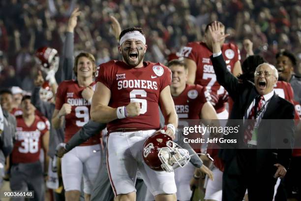 Baker Mayfield of the Oklahoma Sooners celebrates after Steven Parker of the Oklahoma Sooners scores a 46 yard touchdown because of a fumble by Sony...