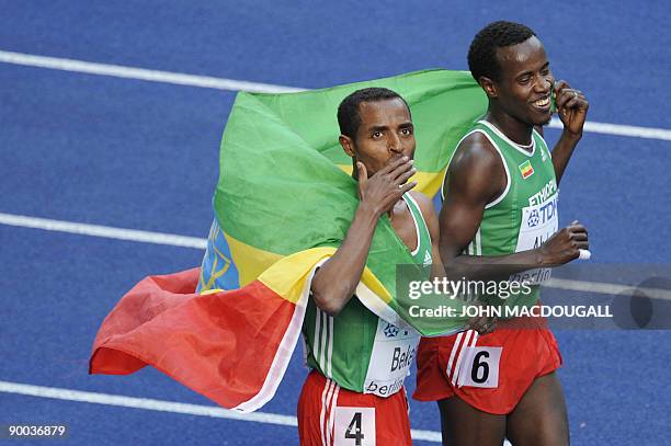 Ethiopia's Kenenisa Bekele and Ethiopia's Ali Abdosh celebrate after the men's 5000m race of the 2009 IAAF Athletics World Championships on August...