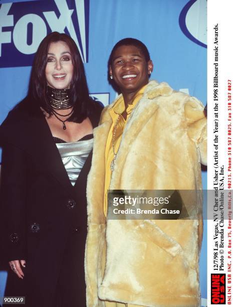 Las Vegas, NV Cher and Usher at the 1998 Billboard Awards.