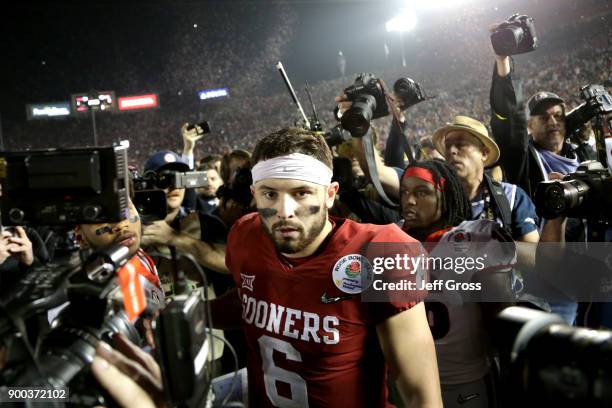 Baker Mayfield of the Oklahoma Sooners walks off the field after playing in the 2018 College Football Playoff Semifinal Game against the Georgia...