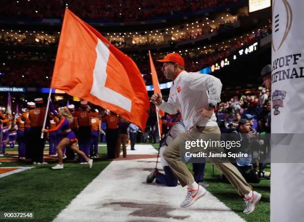 Head coach Dabo Swinney of the Clemson Tigers takes the field prior to the AllState Sugar Bowl against the Alabama Crimson Tide at the Mercedes-Benz...