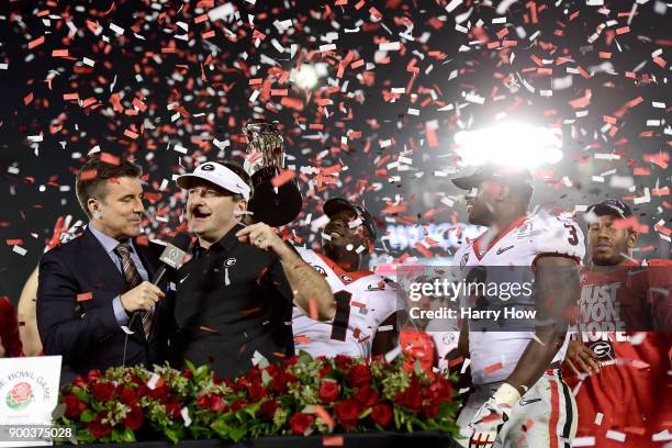 Head Coach Kirby Smart of the Georgia Bulldogs is presented the trophy after the Bulldogs beat the Oklahoma Sooners 54-48 in double overtime in the...