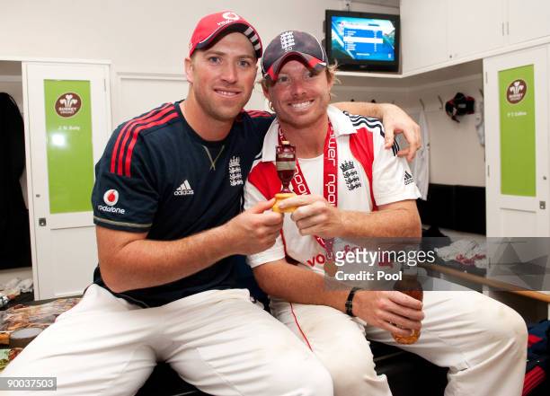 Matt Prior and Ian Bell of England celebrate with the Ashes Urn in the changing room following the fifth npower Test Match at the Oval on august 23,...