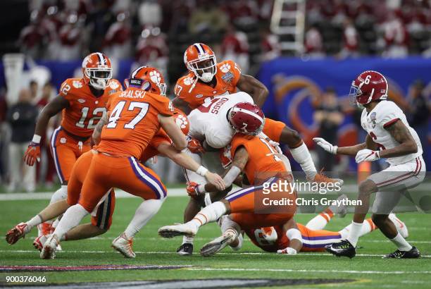 Hunter Renfrow of the Clemson Tigers is tackled by Trevon Diggs of the Alabama Crimson Tide in the first half of the AllState Sugar Bowl at the...