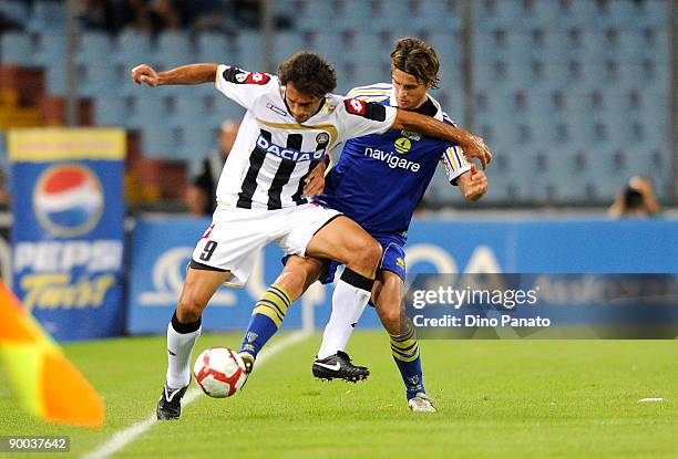 Bernardo Corradi of Udinese battles of the ball with Massimo Paci of Parma during the Serie A match between Udinese Calcio and Parma FC at the Friuli...