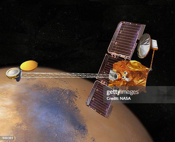 In this artist's conception, NASA's 2001 Mars Odyssey spacecraft is shown in orbit around Mars October 23, 2001. Scientists at NASA's Jet Propulsion...