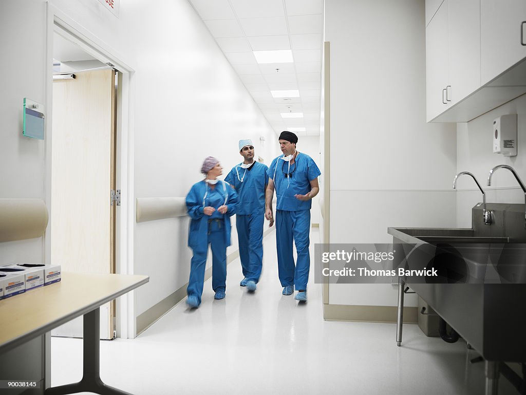 Surgeons walking in hospital hallway