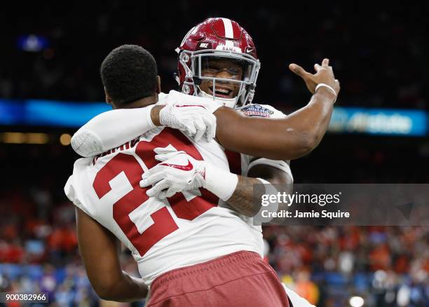 Mack Wilson of the Alabama Crimson Tide celebrates with a teammate in the second half of the AllState Sugar Bowl against the Clemson Tigers at the...