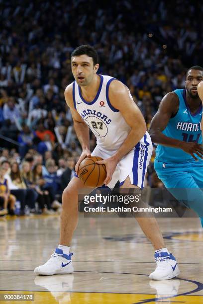 Zaza Pachulia of the Golden State Warriors looks to shoot against the Charlotte Hornets at ORACLE Arena on December 29, 2017 in Oakland, California....