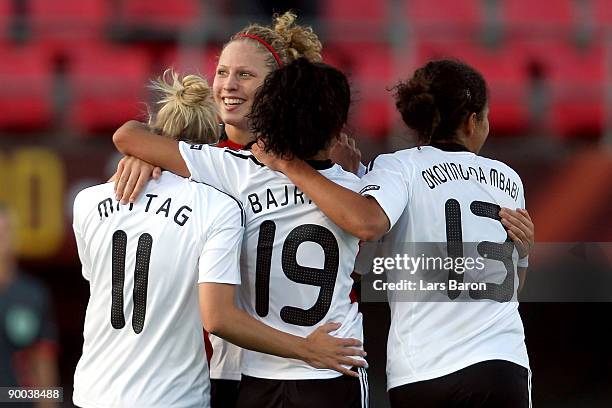 Anja Mittag of Germany celebrates with team mates Kim Kulig, Fatmire Bajramaj and Celia Okoyino da Mbabi after scoring the third goal during the UEFA...