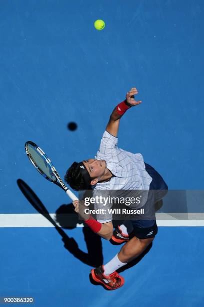 Yuichi Sugita of Japan serves to Jack Sock of the United States in the mens singles match on Day Four of the 2018 Hopman Cup at Perth Arena on...