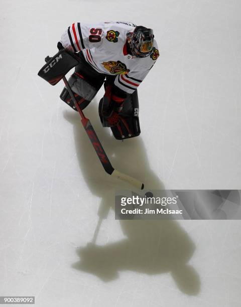 Corey Crawford of the Chicago Blackhawks warms up before a game against the New Jersey Devils on December 23, 2017 at Prudential Center in Newark,...