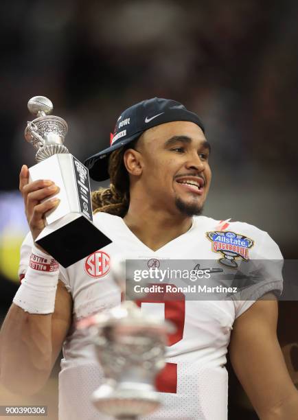 Jalen Hurts of the Alabama Crimson Tide celebrates with the offensive player of the game trophy after the AllState Sugar Bowl against the Clemson...