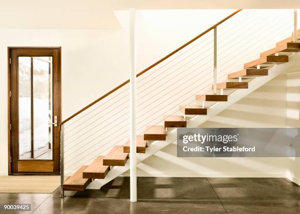 contemporary staircase and door. - railing stock pictures, royalty-free photos & images