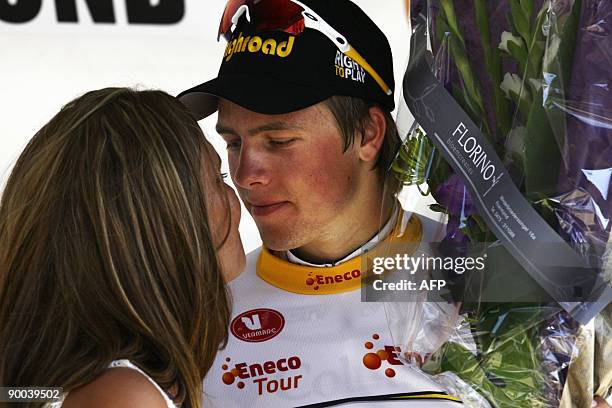 Norway's Edvald Boasson Hagen of Columbia team gets a kiss on the winner stand after he carried off the sixth stage from Genk to Roermond in the the...