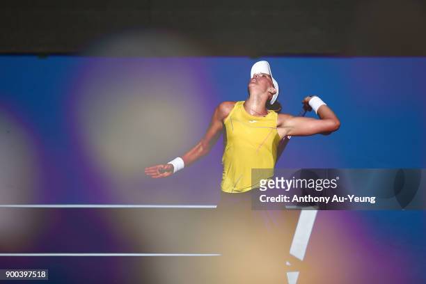 Beatriz Haddad Maia of Brazil serves in her first round match against Agnieszka Radwanska of Poland during day two of the ASB Women's Classic at ASB...