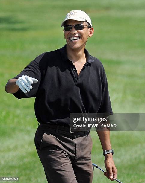 President Barack Obama walks after teeing off at the Farm Neck Golf Club in Oak Bluffs on Martha's Vineyard, Massachusetts, on August 24, 2009. The...