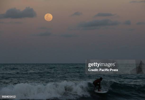 The first super moon of 2018 is seen from Ponta Negra beach. A super moon is a moon that is full and at its closest point in orbit around the Earth....