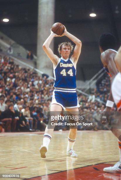 Dan Issel of the Denver Nuggets looks to pass the ball against the New Jersey Nets during an NBA basketball game circa 1977 at the Rutgers Athletic...