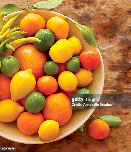 bowl of citrus fruits - yuzu stock pictures, royalty-free photos & images