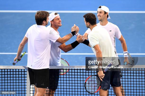 Grigor Dimitrov of Bulgaria and Ryan Harrison of USA after their doubles match against Lleyton Hewitt and Jordan Thompson of Australia during day...