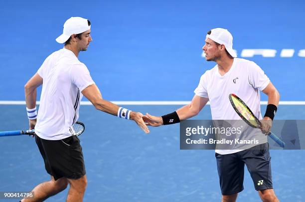 Lleyton Hewitt and Jordan Thompson of Australia celebrate in their doubles match against Grigor Dimitrov of Bulgaria and Ryan Harrison of USA during...